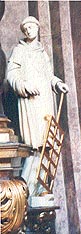 Statue des heiligen Laurentius in der Paulanerkirche in Wien,; dargestellt als Diakon mit dem Rost.